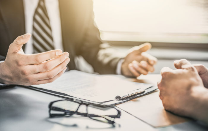 two businessmen negotiating a commercial lease