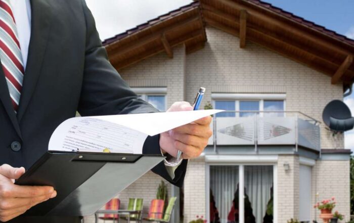 Man in suit looking at papers to put a lien on a property