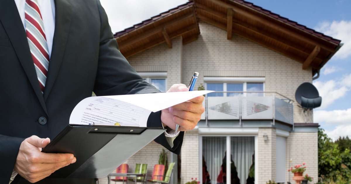 Man in suit looking at papers to put a lien on a property